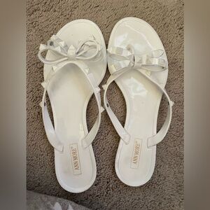 Ann More rubber flip flops with bow